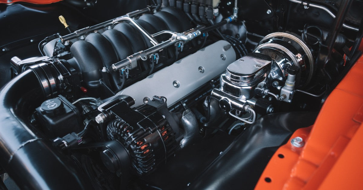 A close-up of a large motor block with intricate, shiny, well-maintained parts and an impressive design.
